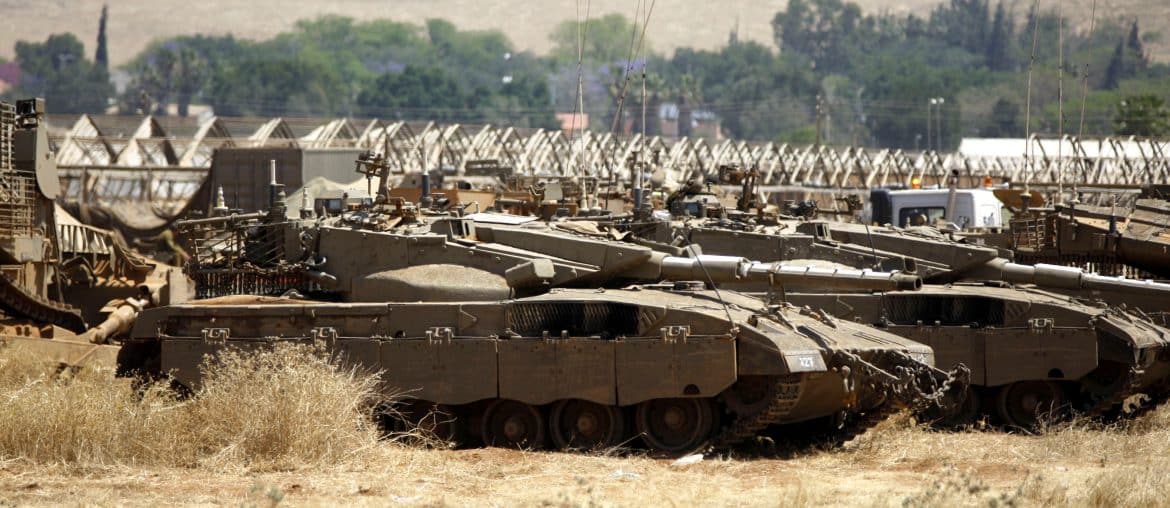 Israeli military vehicles on Palestinian agricultural land in the Jordan valley, near the West Bank town of Tubas, May 6, 2015. (Photo: Shadi Hatem/APA Images)