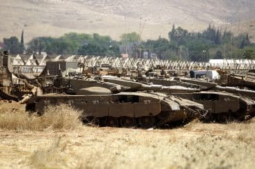 Israeli military vehicles on Palestinian agricultural land in the Jordan valley, near the West Bank town of Tubas, May 6, 2015. (Photo: Shadi Hatem/APA Images)
