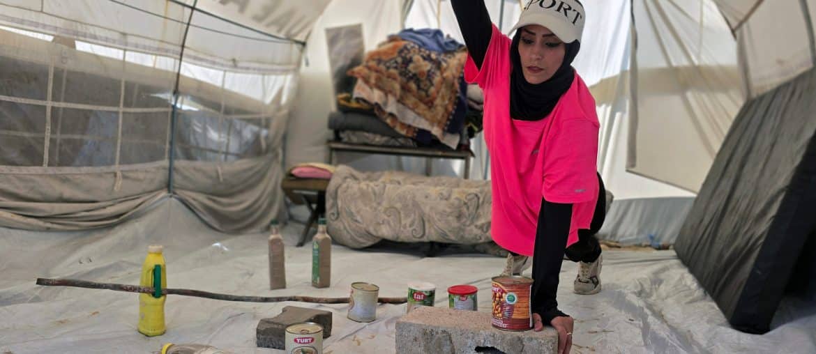 Palestinian fitness trainer Iman al-Mughir uses empty food cans and other waste items as part of her makeshift gym in Mawasi, Khan Younis, August 11, 2026. (Photo: Tariq Mohammad/APA Images)