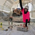 Palestinian fitness trainer Iman al-Mughir uses empty food cans and other waste items as part of her makeshift gym in Mawasi, Khan Younis, August 11, 2026. (Photo: Tariq Mohammad/APA Images)