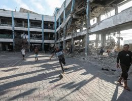 Displaced children play football in the courtyard of an UNRWA school in al-Bureij refugee camp in the central Gaza Strip on June 13, 2026. (Photo: Moiz Salhi/APA Images)