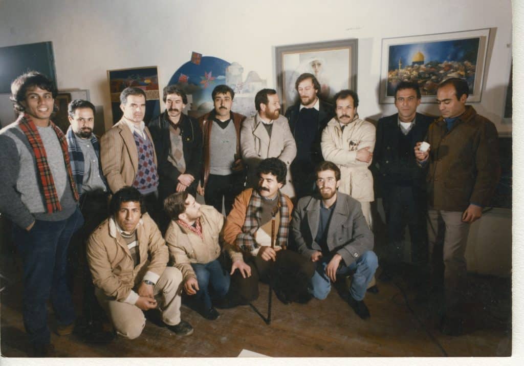 Palestinian visual artists at an exhibition at the Hakawati Theater in Jerusalem, 1986. (Photo: Palestinian Museum Digital Archive)