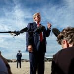 President Donald J. Trump speaks with members of the press before boarding Air Force One at Joint Base Andrews, Maryland, Friday, August 21, 2026. (Photo: White House/Flickr, by Molly Riley)