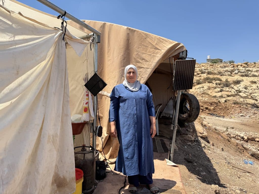 A member of the Abu Hammam family, the only family left in al-Mughayyir that still owns a flock of sheep, which was halved in recent years, falling to just 130 head, after the family was barred from reaching grazing land by the Israeli army and settlers in the West Bank village of al-Mughayyir, July 2026. (Photo: Shatha Hammad)