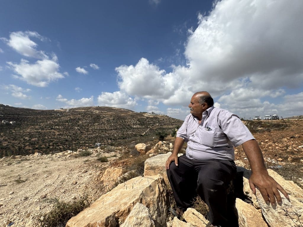 Abdul Karim Hassan, whose family is besieged on the Ras al-Ain hill outside the village of Qusra, south of Nablus in the central West Bank, August 2026. (Photo: Shatha Hammad)