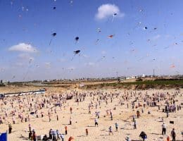 Palestinian children fly kites along the beach during a U.N.-run summer camp in Gaza City on July 29, 2010. (Photo: Mohammed Asad/APA Images)