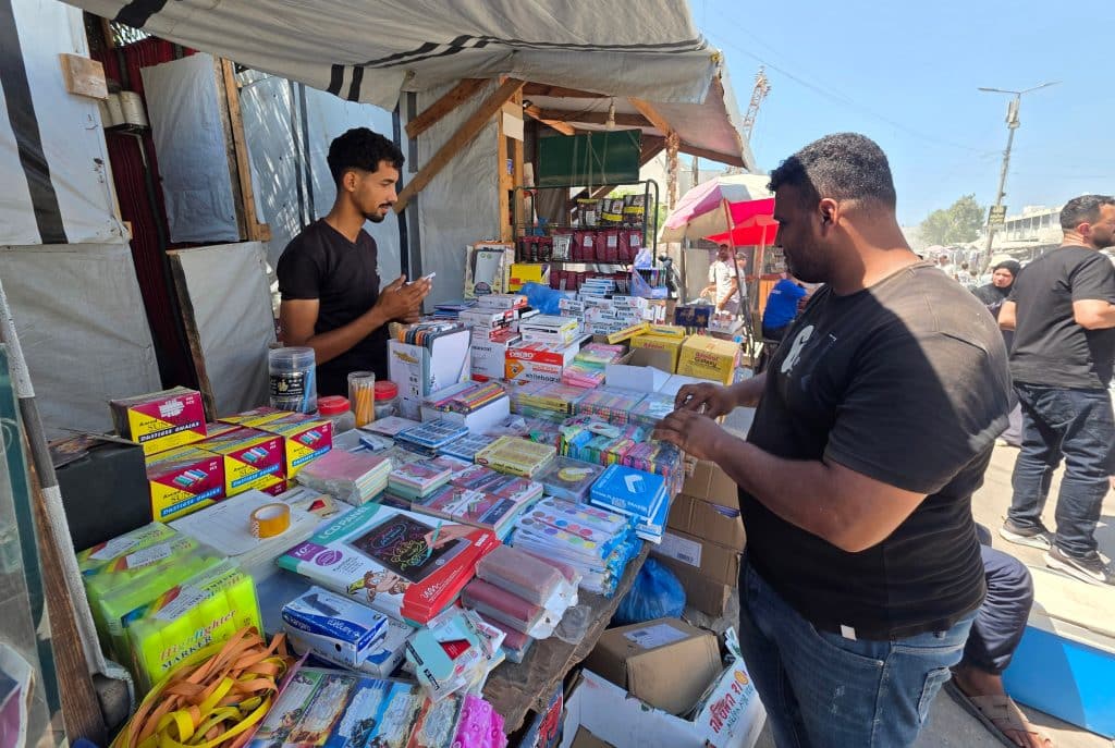 Palestinians shop for school supplies from stalls in the Khan Younis open market in the southern Gaza Strip, September 13, 2026, ahead of the start of the new school year. (Photo: Tariq Mohammad/APA Images)