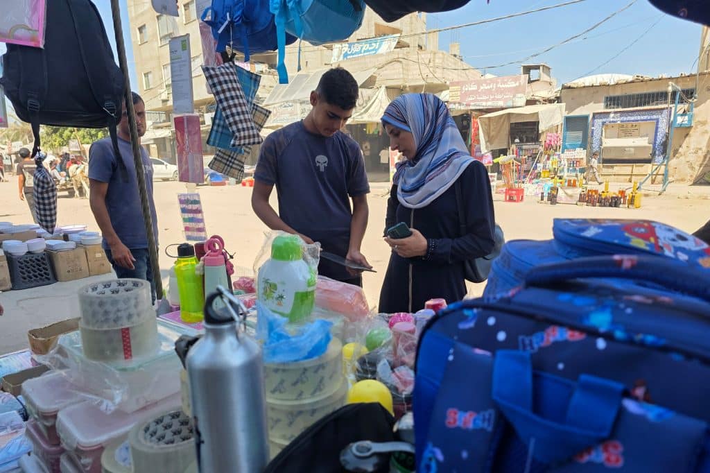 Palestinians shop for school supplies from stalls in the Khan Younis open market in the southern Gaza Strip, September 13, 2026, ahead of the start of the new school year. (Photo: Tariq Mohammad/APA Images)