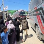 Palestinian patients accompanied by their relatives line up to depart Gaza for the Rafah crossing for treatment abroad, June 17, 2026. (Photo: Tariq Mohammad/APA Images)