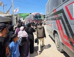 Palestinian patients accompanied by their relatives line up to depart Gaza for the Rafah crossing for treatment abroad, June 17, 2026. (Photo: Tariq Mohammad/APA Images)