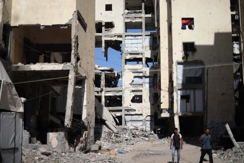 Palestinians live inside damaged residential towers and tents in the northern Gaza Strip amid news of collapsing buildings in the Strip, September 17, 2026. (Photo: Bilal Osama/APA Images)