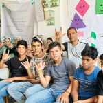 Fadl Kurraz with teachers and students at the educational sites. (Photo courtesy of the author)