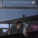 A Palestinian child looks out the window of a bus crossing into Egypt from the Gaza Strip through the Rafah border crossing, on February 6, 2024. (Photo: © Abed Rahim Khatib/DPA via ZUMA Press/APA Images)