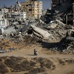 Temporary tents sheltering displaced Palestinians stand beside destroyed buildings in Gaza City on October 7, 2026, on the third anniversary of the outbreak of the war. (Photo: Bilal Osama/APA Images)