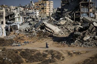 Temporary tents sheltering displaced Palestinians stand beside destroyed buildings in Gaza City on October 7, 2026, on the third anniversary of the outbreak of the war. (Photo: Bilal Osama/APA Images)