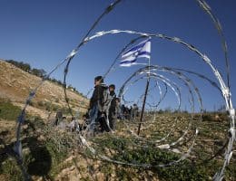 Israeli settlers block the main road leading to schools in Khirbet Umm al-Khair, near Hebron, in the southern West Bank, by erecting a fence, hindering students' access to education due to the lack of safe alternative routes. Hebron, West Bank, April 14, 2026. (Photo by Mamoun Wazwaz/ apaimages)