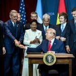 Dominican Republic President Luis Abinader shakes Donald Trump's hand during the Shield of the Americas summit on March 7, 2026, in Miami, Florida. (Official White House Photo by Molly Riley)