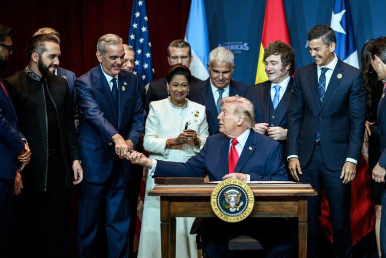 Dominican Republic President Luis Abinader shakes Donald Trump's hand during the Shield of the Americas summit on March 7, 2026, in Miami, Florida. (Official White House Photo by Molly Riley)